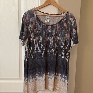 A line southwest style top with silver bling around the neck